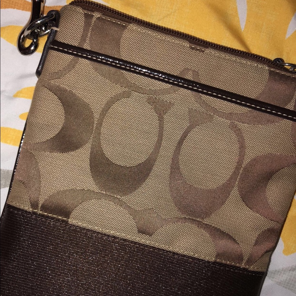 Brown Coach cross body hand bag
